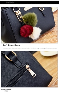 Detail of black pebbled leather texture, gold zipper, and tricolor pompom charms