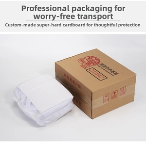 Professional packaging detail showing sturdy cardboard box and protected leather handbag inside.