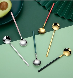 Detailed close-up of 304 stainless steel dessert spoons in various colorful finishes