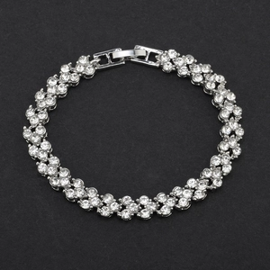 Detailed top view of a silver-toned zircon bracelet with a secure plug-in buckle