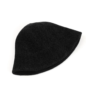 Close-up of thick black chenille fabric texture and ribbed knit on bucket hat