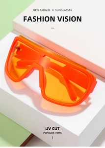 Detail view of orange sports shield sunglasses with UV protection on geometric blocks