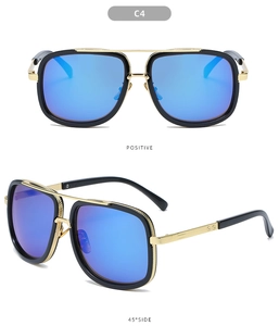 Detail view of square double bridge sunglasses with blue mirrored lenses and gold frame