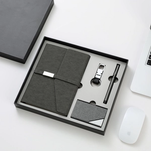 Business gift set with notebook, card holder, keychain and pen in elegant grey gift box