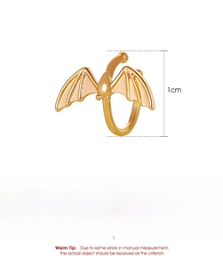 Detail shot of golden bat wing ear cuff with 1cm diameter and copper material specs