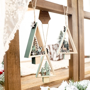 Three rustic wooden Christmas star pendants with laser-cut deer and snowflake patterns