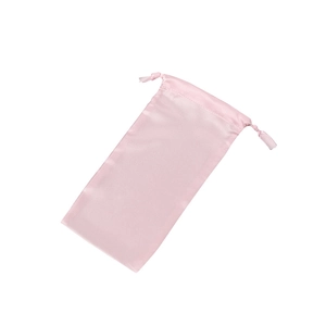 Single pink silk satin drawstring storage pouch bag isolated on white background