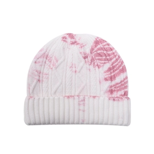 Close-up of cable knit texture on a white and pink tie-dye beanie with ribbed edge