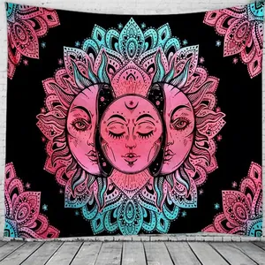 Detail of bohemian tapestry featuring sun and moon mandala on minimalist white brick wall