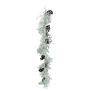 Snow-flocked Christmas pine garland with natural pine cones for holiday door decoration