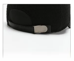 Close-up of adjustable strap and metal buckle on winter baseball cap for men