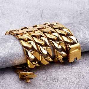 Macro shot of 18K gold plated stainless steel Cuban link chain with polished texture