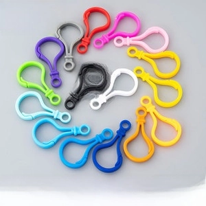 Close-up of colorful acrylic lobster clasps for DIY jewelry making in multiple vibrant colors