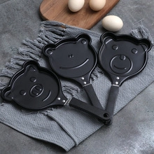 Detailed view of animal-shaped non-stick frying pans including bear, frog, and pig designs