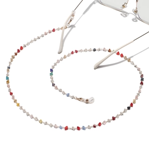 Golden eyewear chain with colorful triangular crystal beads in a spiral arrangement