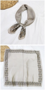 Dettaglio foulard in seta champagne con bordi geometrici vintage e finitura lucida