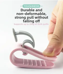 Close-up of flexible pink quilt clip demonstrating high toughness for thick duvets
