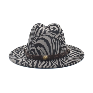 Zebra print wide brim wool fedora hat with brown leather band and metallic buckle detail