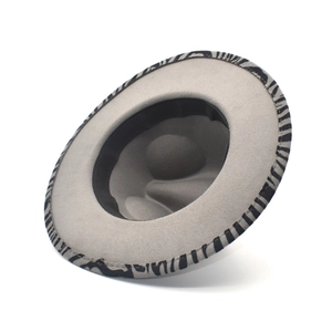 Detail view of grey wool fedora hat with zebra pattern fabric trim on the brim