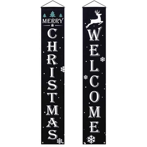 Close-up of black Merry Christmas and Welcome hanging porch banners with reindeer design
