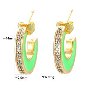 Detail of C-shaped gold earrings with green enamel coating and white zircon inlay edges