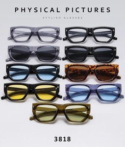 Flat lay of retro chunky square sunglasses in multiple colors with metallic rivets