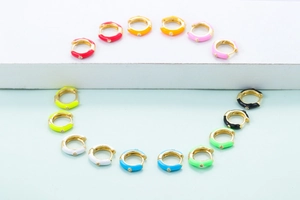 Colorful enamel huggie earrings with gold plating and sparkling zircon stone accents
