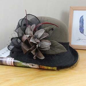 Detail showing the retro wool felt hat with mesh veil and fabric flower decoration