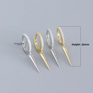 Detail view of spiked hoop earrings with dimensions 8.5mm inner diameter and 26mm height