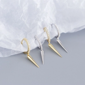 Macro view of S925 sterling silver long rivet hoop earrings with micro-set zircons