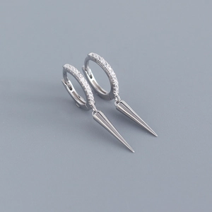 Close-up of S925 sterling silver earrings with micro-set zircon and sleek spike pendants