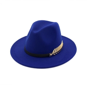 Close-up of dark blue wool fedora hat featuring black ribbon and gold feather accessory