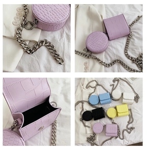 Detail view of crocodile pattern crossbody bag set with chunky silver chain and round pouch