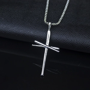 Detailed close-up of a silver stainless steel baseball bat cross necklace pendant