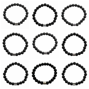 Set of 9 matte black stone zodiac bracelets with silver charms on white background