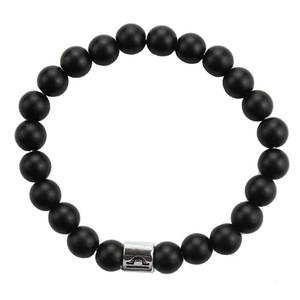 Detail of 8mm matte black stone bracelet featuring a silver Libra zodiac charm