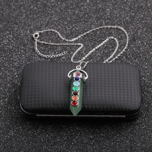 Silver chain necklace with a green hexagonal pendant featuring seven chakra gemstones