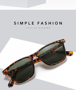 Detailed macro view of tortoiseshell sunglasses frame with premium dark green lenses