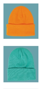 Detailed knit texture of cuffed orange and cyan beanies for autumn and winter kids' wear