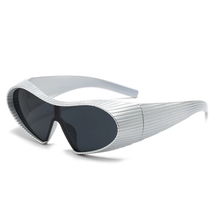 Steampunk futuristic silver sunglasses with wrap-around frame and Y2K aesthetic