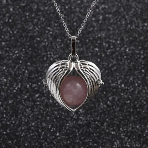 Silver stainless steel necklace with angel wing pendant and pink crystal bead
