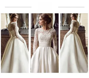 Detail of white lace embroidery bodice and satin skirt on long sleeve wedding gown
