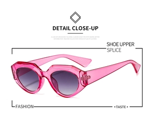 Detail view of pink transparent polygonal sunglasses with dark grey gradient lenses