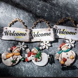 Three-piece Christmas snowman Welcome hanging ornaments with rustic rope on grey background