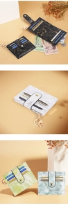 Detail view of marble pattern card holders with metal snap button and key ring hook