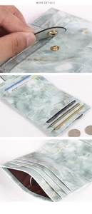 Detail view of mint green marble wallet showing card slots and snap button closure
