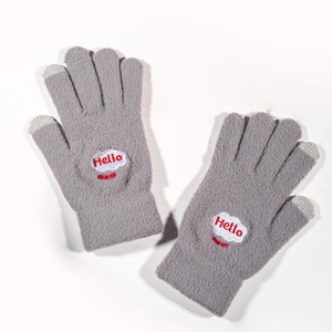 Detail of gray knit gloves with cloud embroidery and conductive touchscreen fingertips