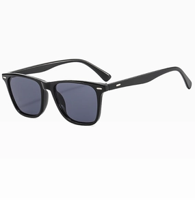 Close-up of classic black Wellington sunglasses with silver rivets and grey lenses