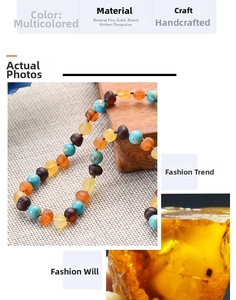 Macro shot of handmade natural amber and turquoise multi-gemstone necklace for babies