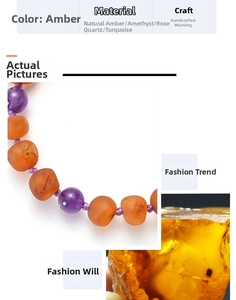 Macro shot of natural baltic amber bracelet featuring amethyst and turquoise beads